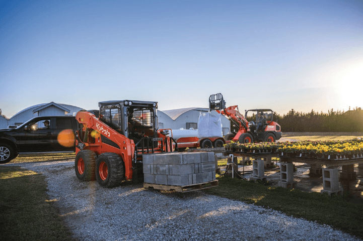 Skid steer moving pallet of cinder blocks